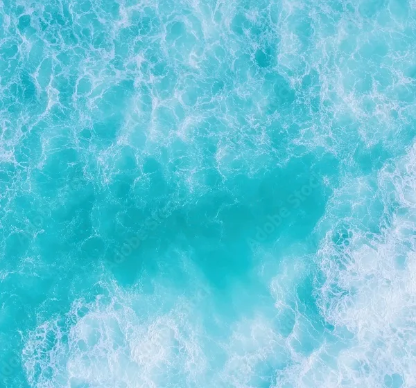 Aerial view of blue and turquoise ocean waves showing natural beauty and tranquility Aerial view of blue and turquoise ocean waves showing natural beauty and tranquility